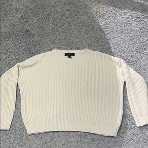 A white knitted sweater.